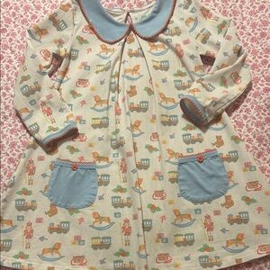 Adorable Christmas Toy Patterned Dress with Blue Accents